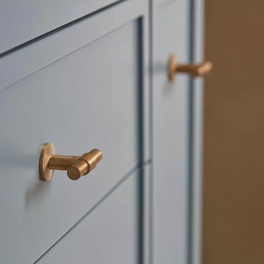 product lifestyle image of Roper Rhodes Untreated Brass Toledo T-Bar Handle on grey unit FHTOLHANA